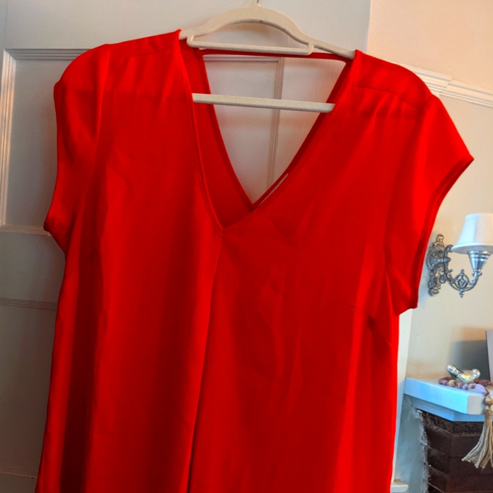 Bright orange blouse